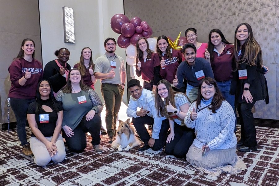 Toxicology students and prospective students pose with Miss Reveille